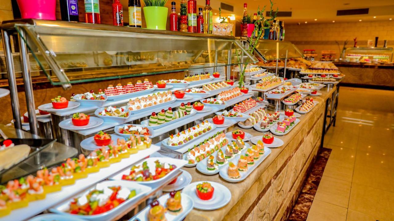 Titanic Palace Families And Couples Only Hurghada Exterior photo A buffet at a hotel